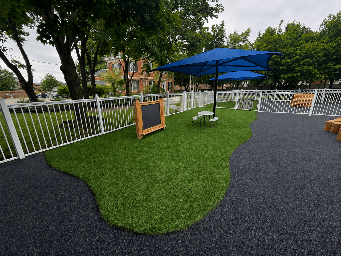 Rubber surfacing and artificial turf at a daycare playground