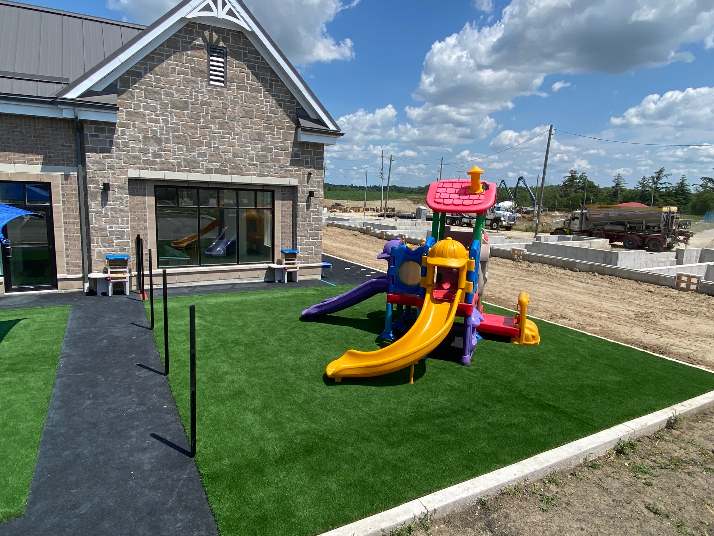 Artificial turf with a play structure