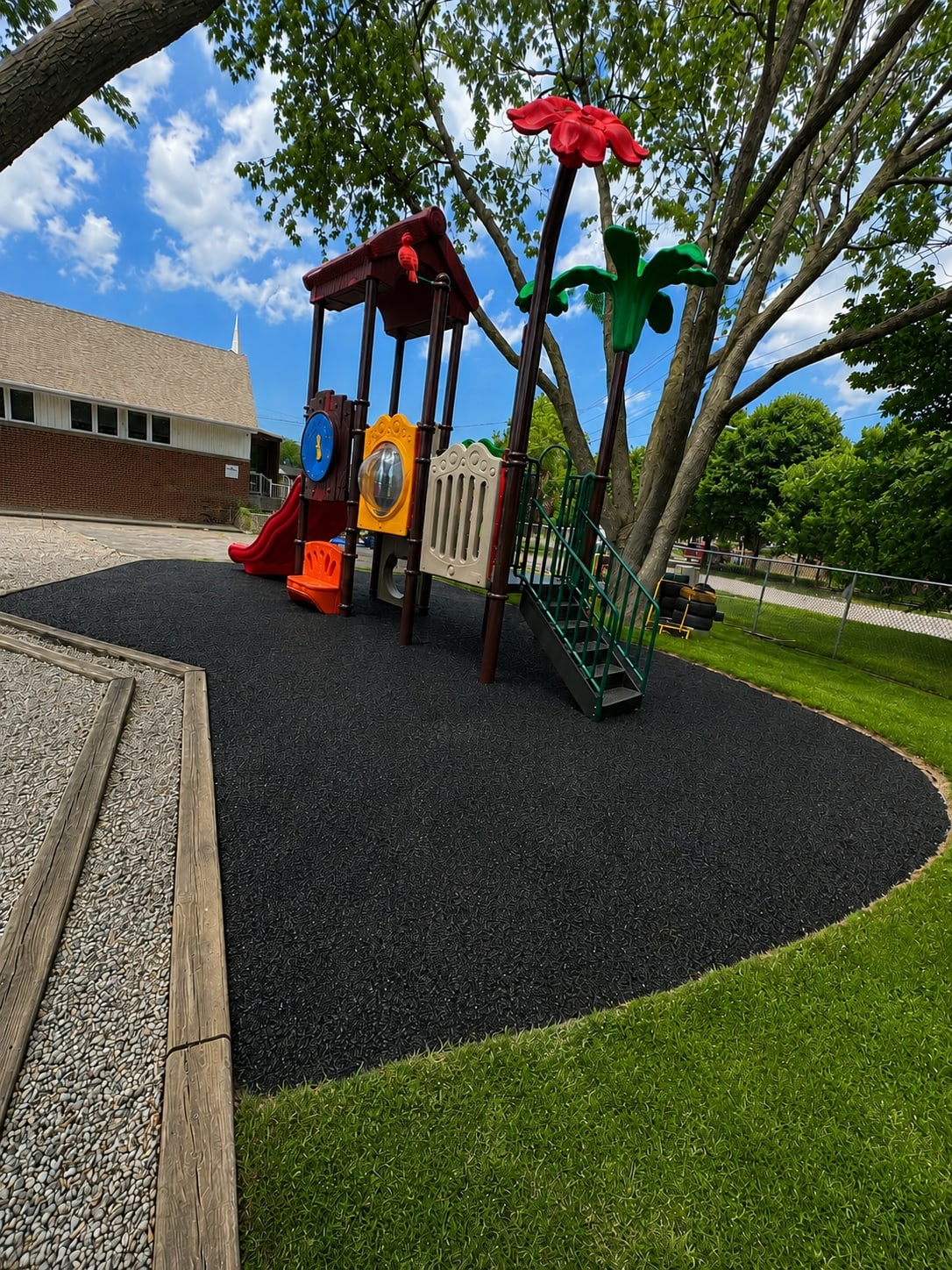 Daycare playground with rubber surfacing