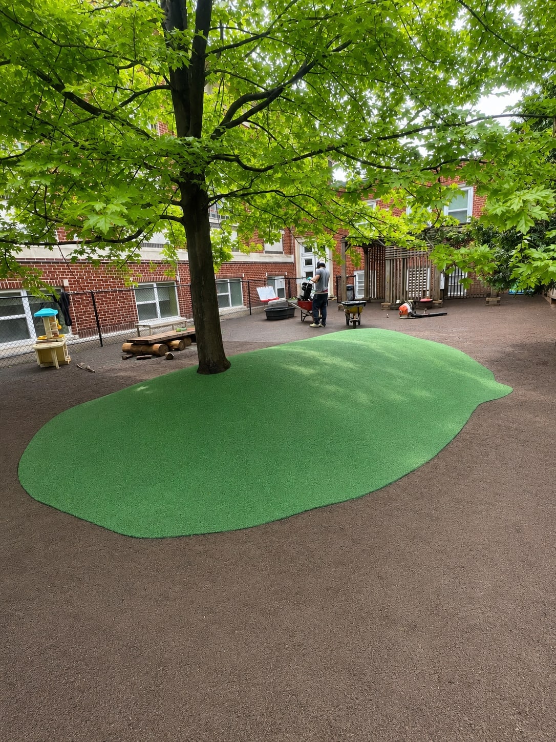 Green rubber surfacing on a playground