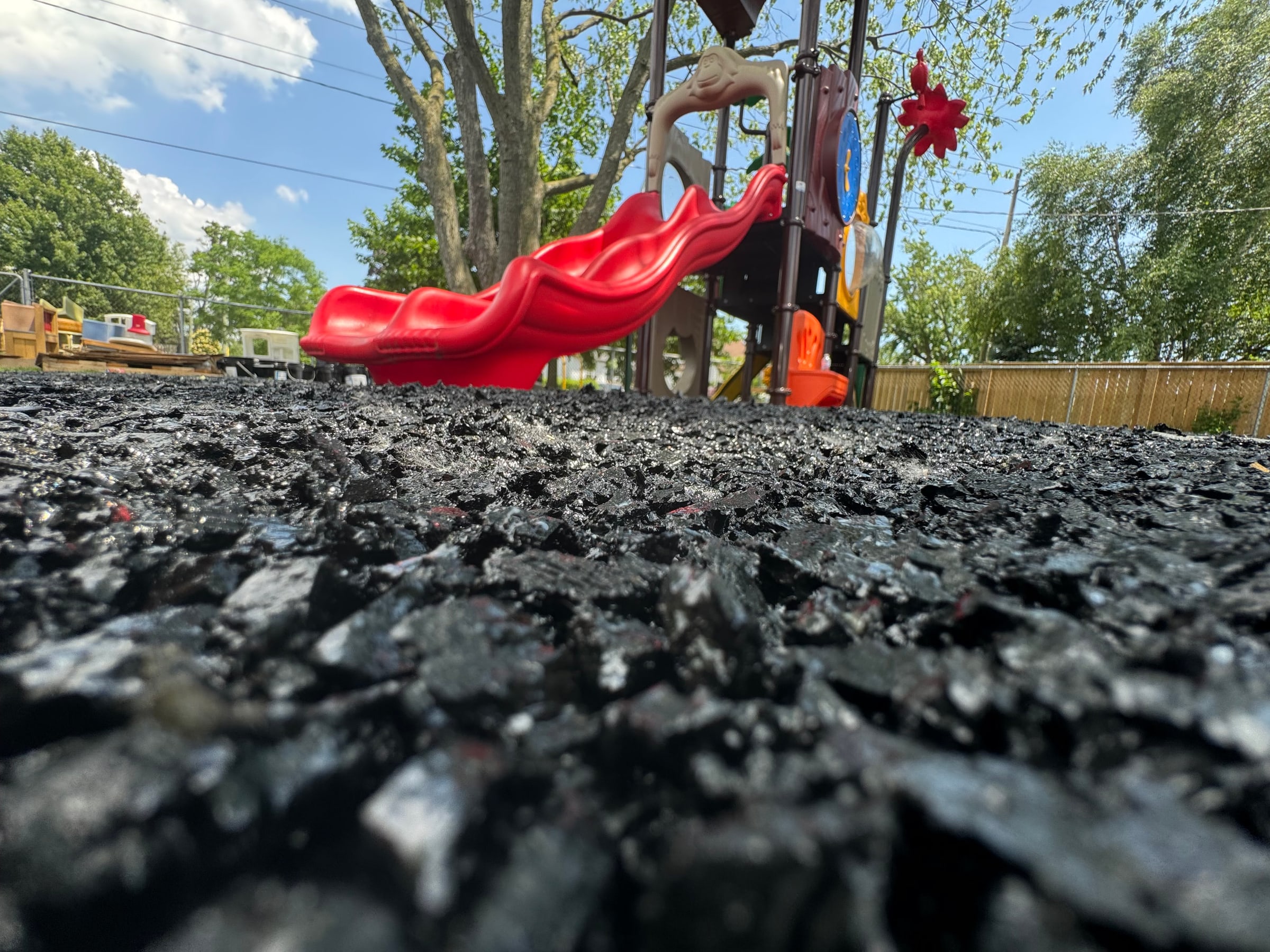 Impact base layer for rubber surfacing installation