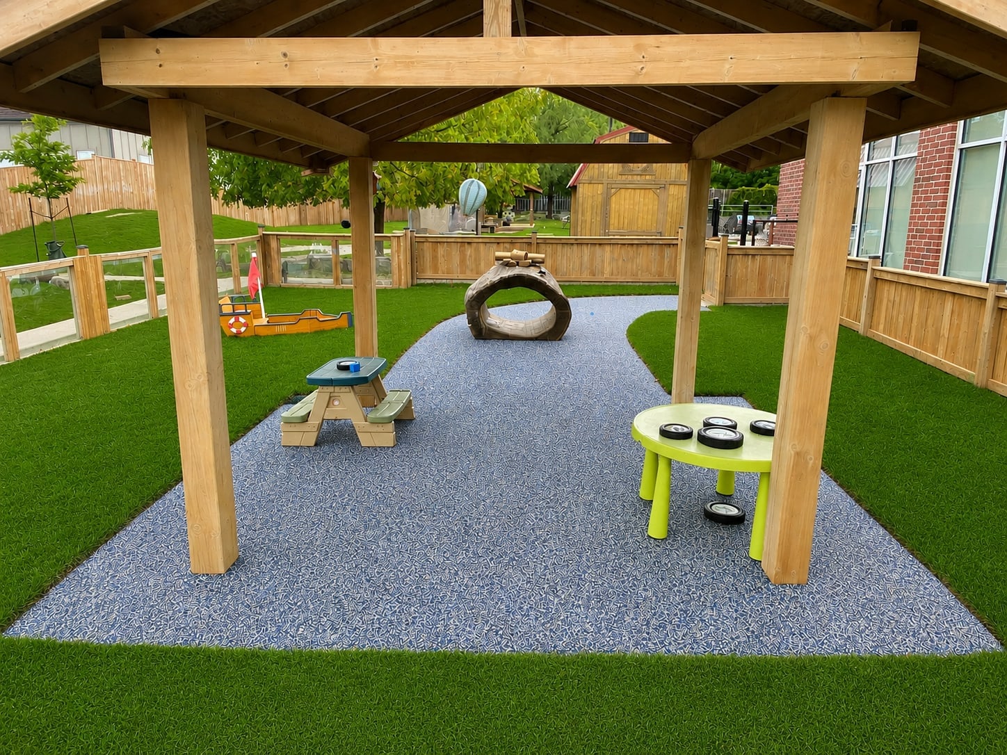 Log tunnel play area with rubber surfacing