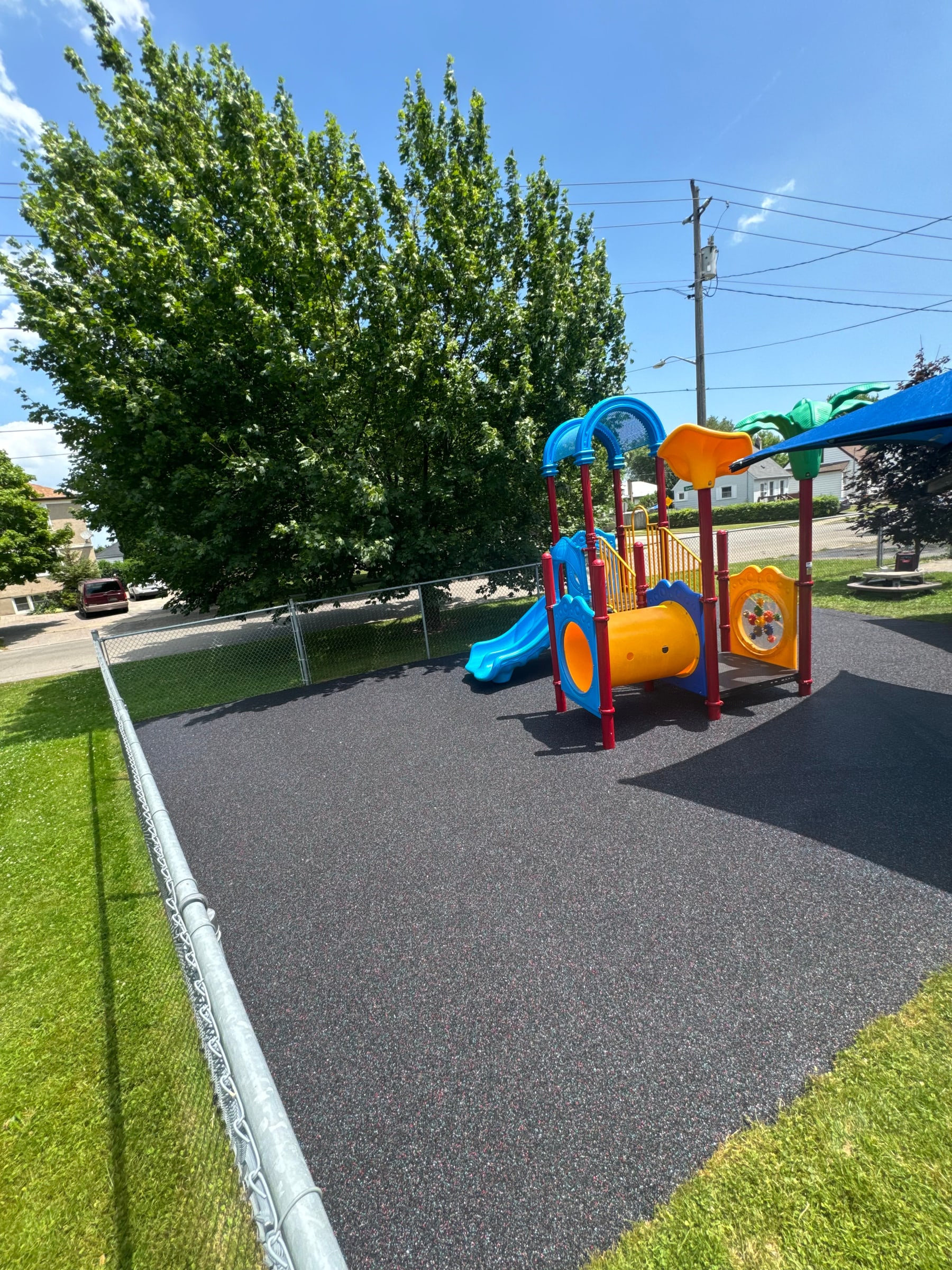 Rubberscape rubber surfacing around a playset