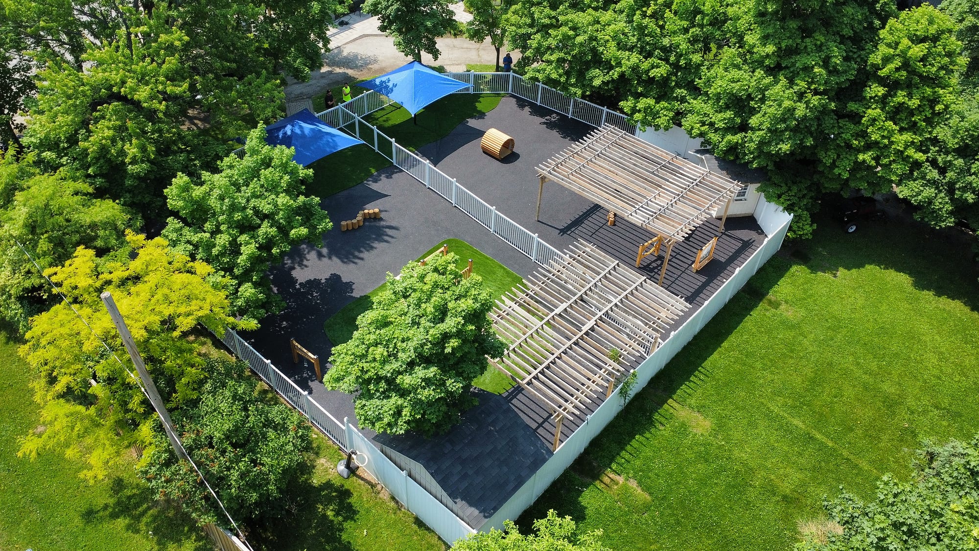 aerial daycare playground shade sails pergolas rubber surface