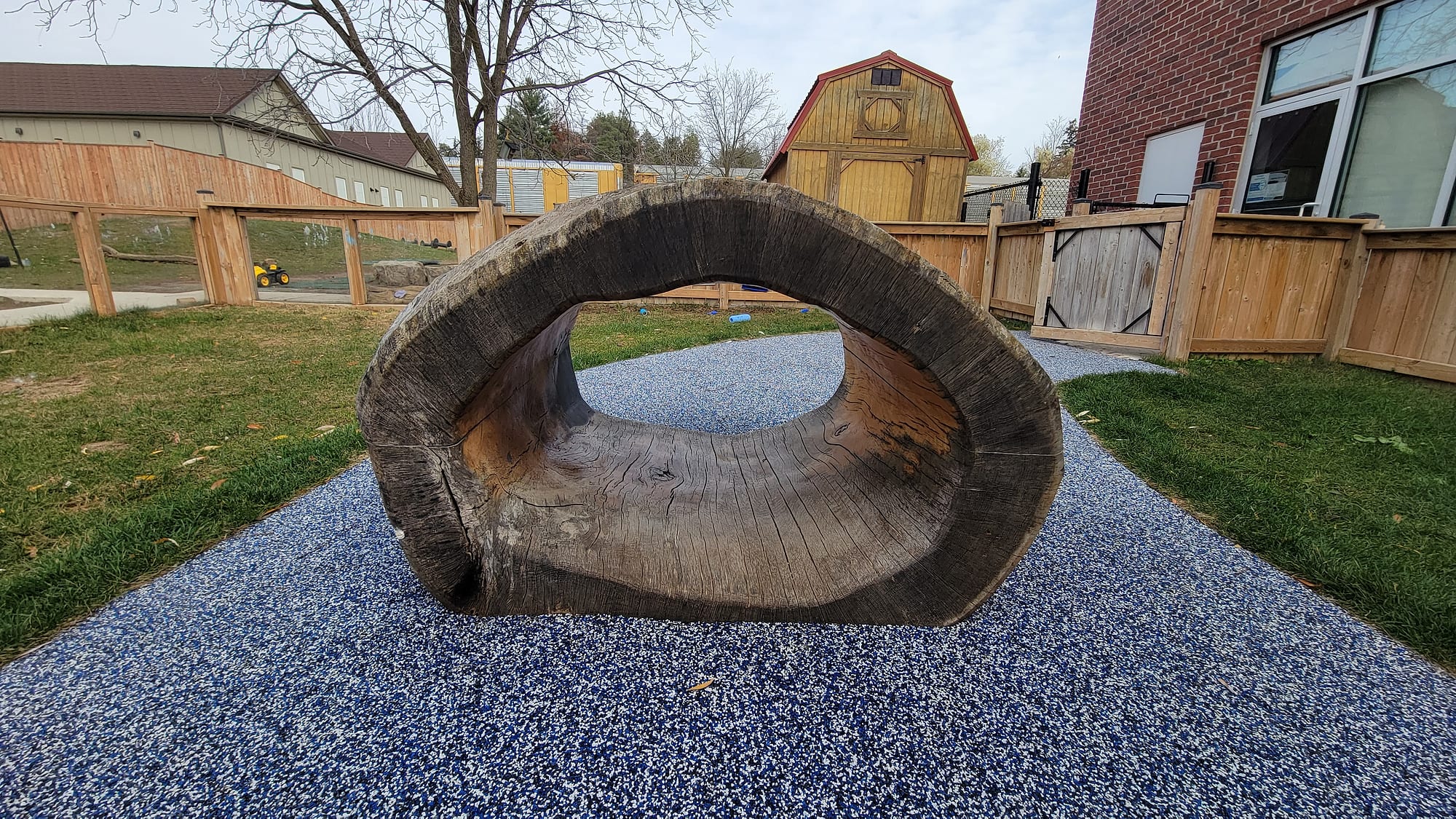 daycare playground log tunnel rubber surfacing