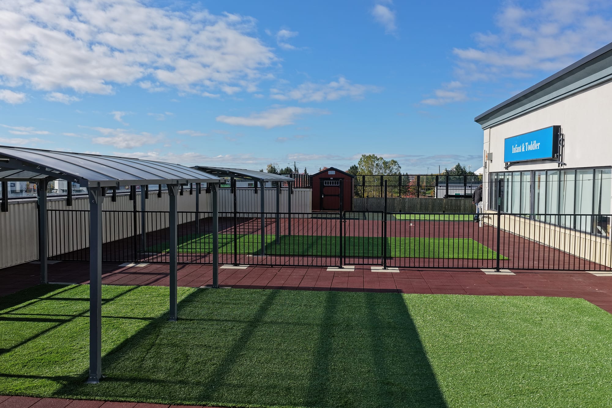 fenced artificial turf play area rubber surfacing