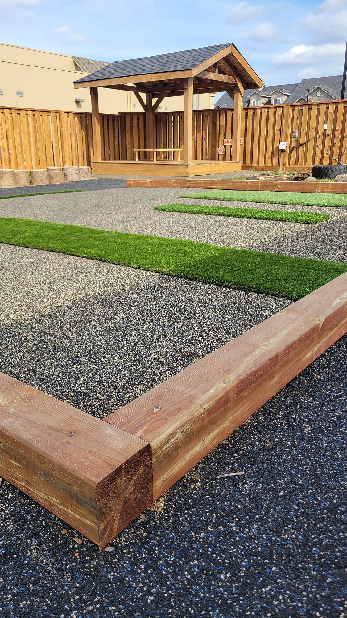 raised daycare play area rubber surfacing turf