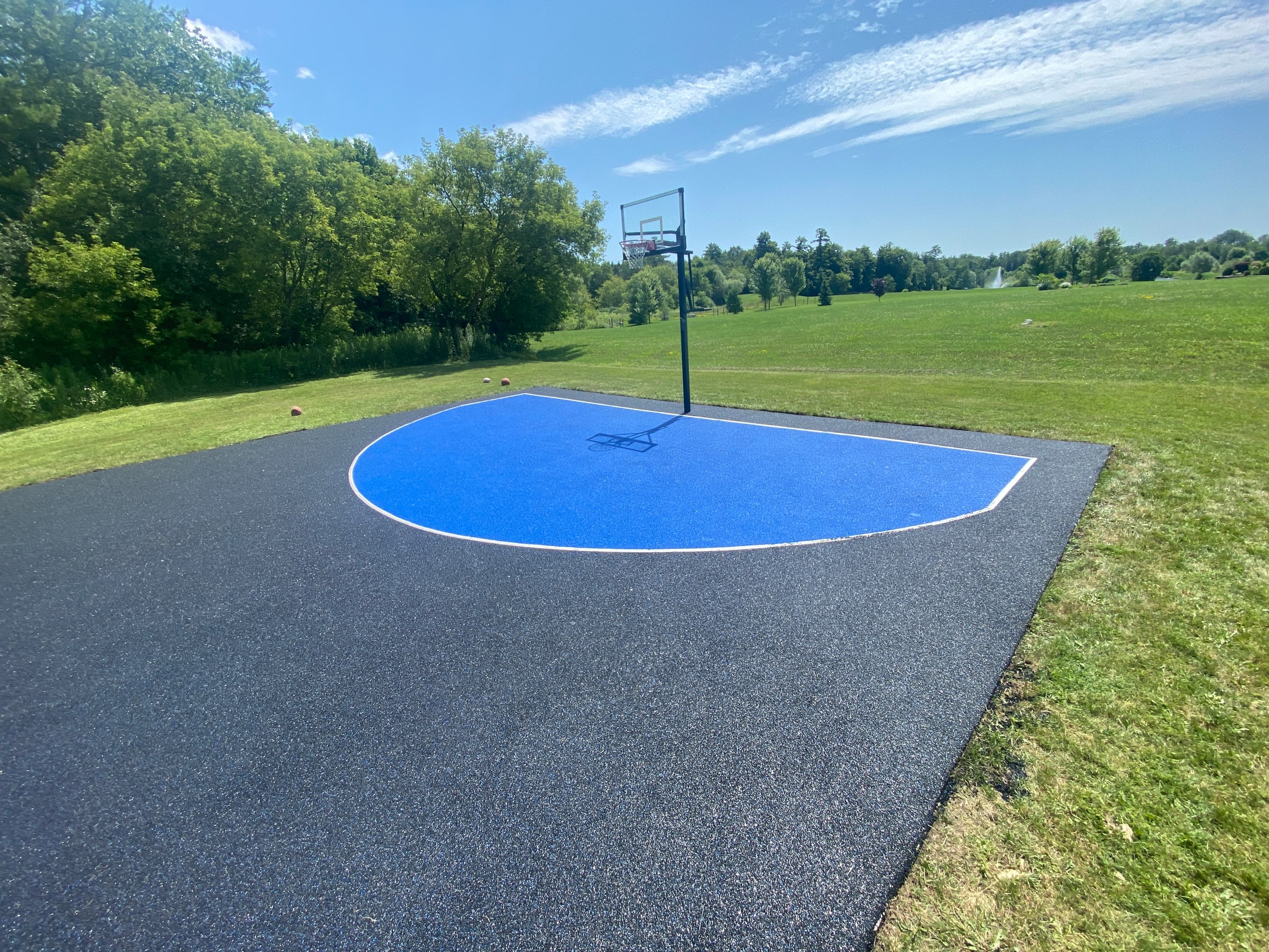 Backyard sport court basketball surface