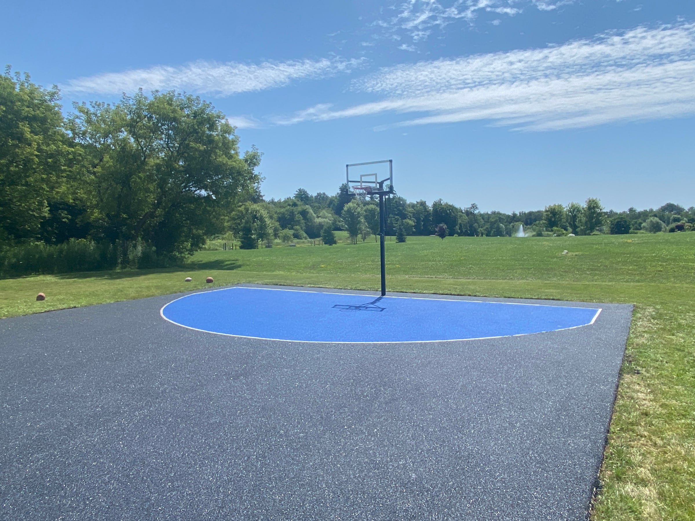 Basketball court in backyard setting