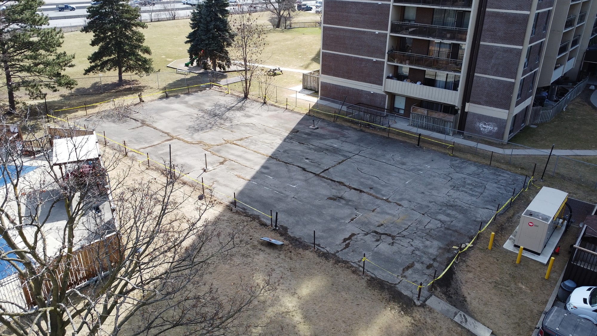 Apartment sports court before resurfacing