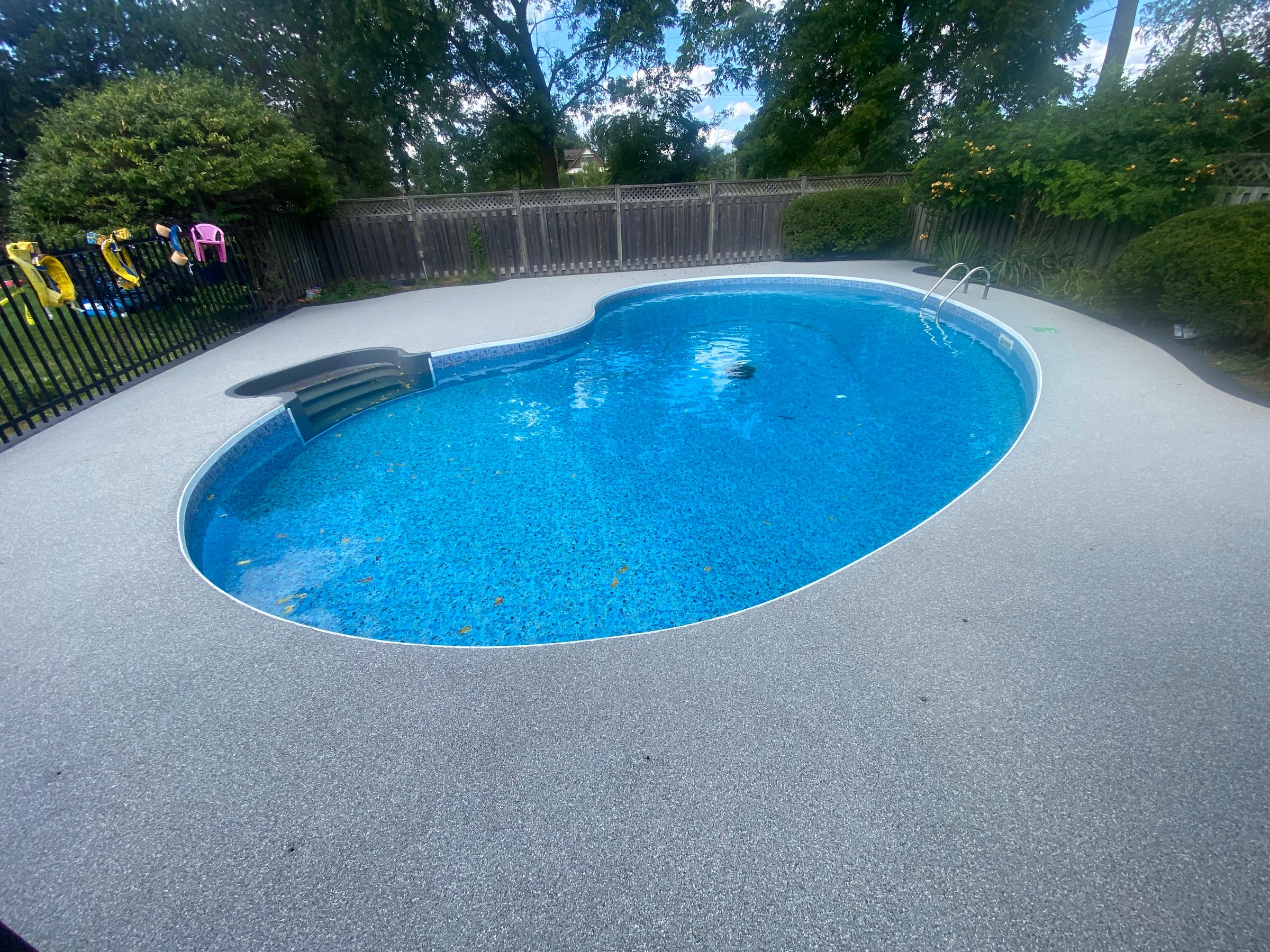 Grey rubber pool deck surface