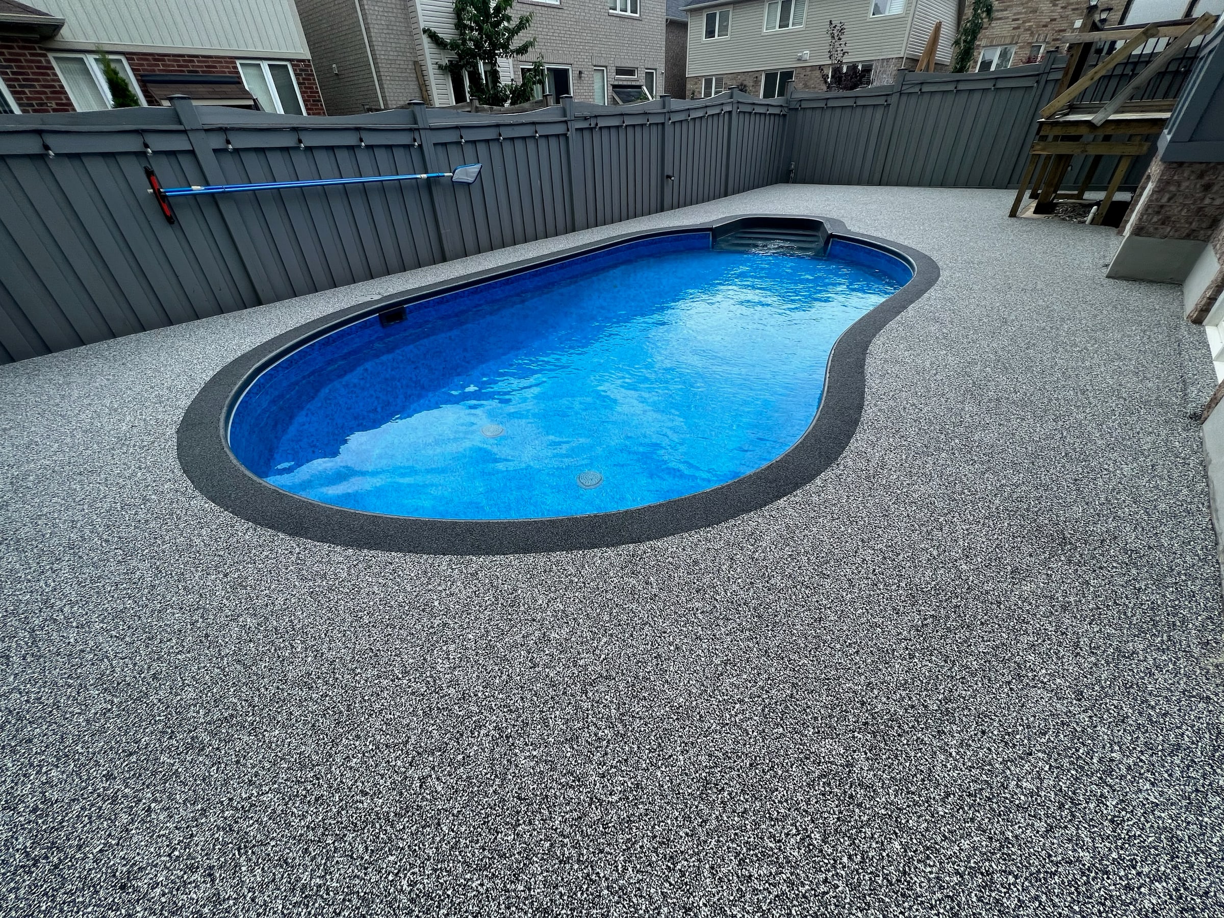 Grey rubber surfacing pool deck