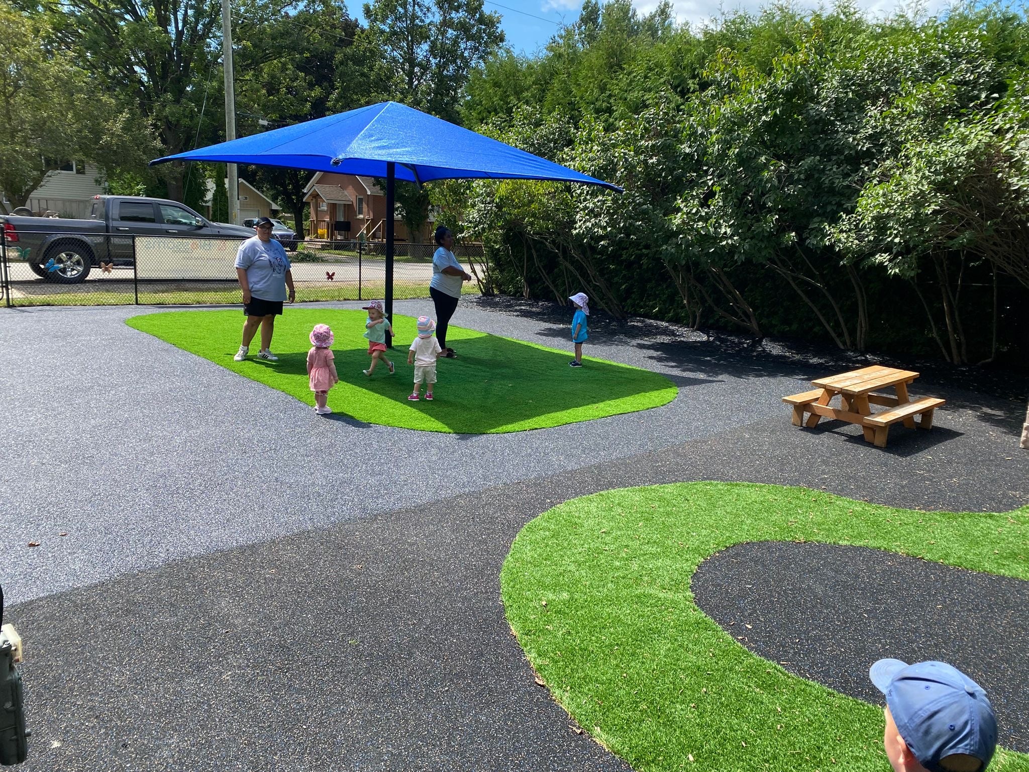 Blue sun shade installed by Rubberscape