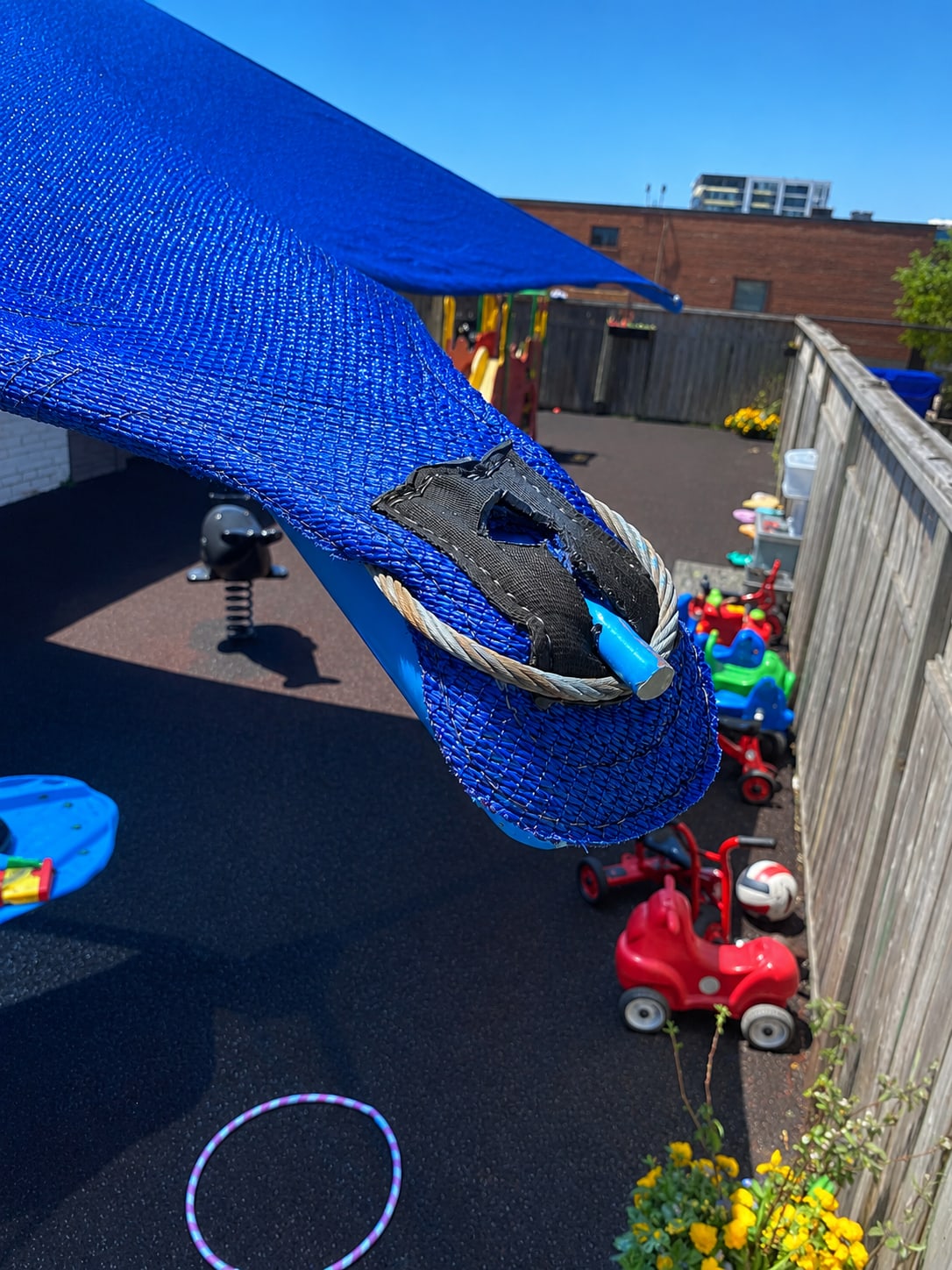 Blue sun shade providing UV protection at a daycare