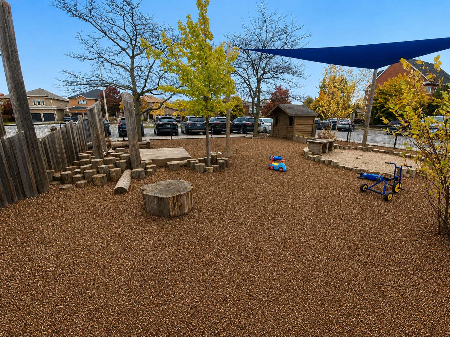 Blue sun shade over a natural playground