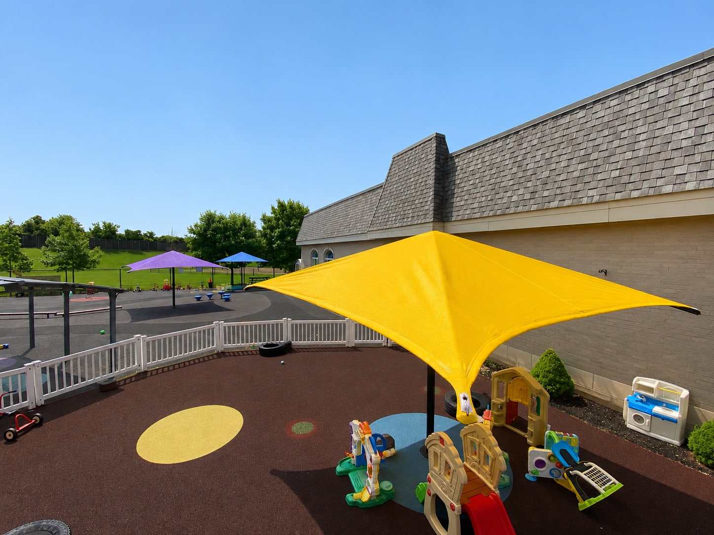 Yellow sun shade for a daycare