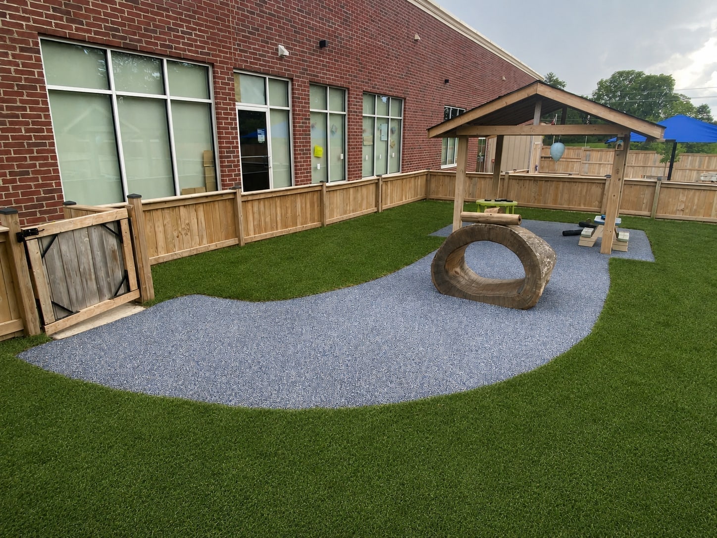 Rubber surfacing turf and log tube playground maintenance