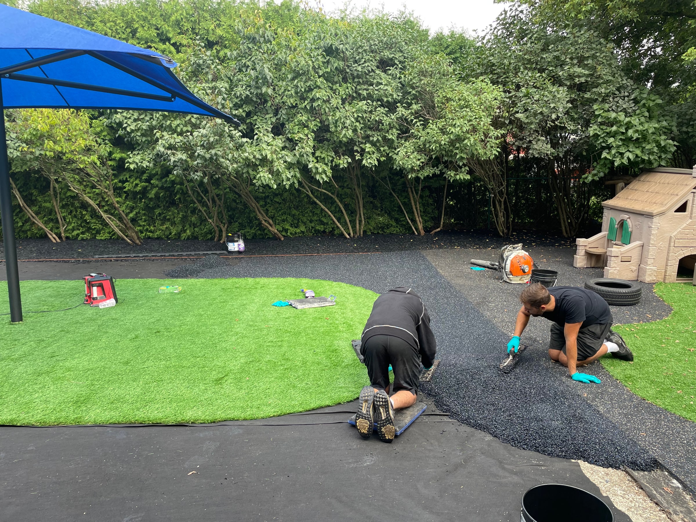 Artificial turf and rubber track installation
